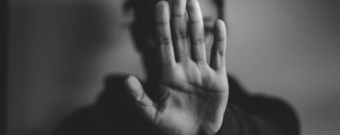 hand in front of face