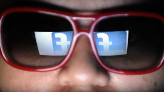 facebook logo reflected in glasses