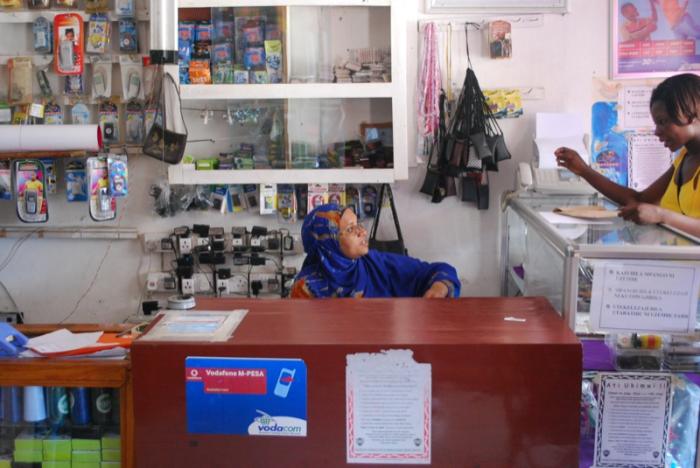 Two women at a mobile phone kiosk