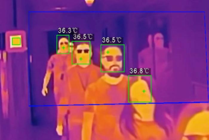 A screenshot of a thermographic camera showing several subjects