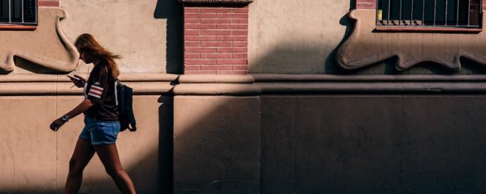 woman walking with phone