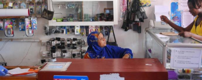 Two women at a mobile phone kiosk