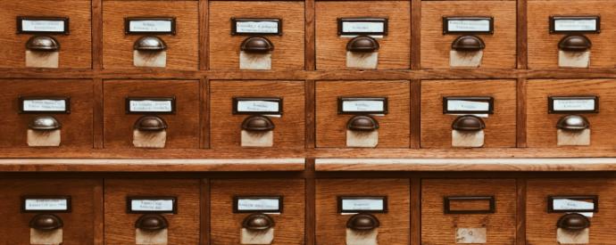 wooden drawers of paper archives