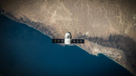 A satellite hovering a coastline 