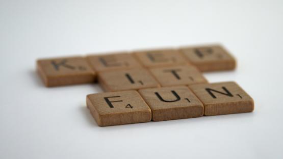 Wooden blocks aligned to spell Keep It Fun