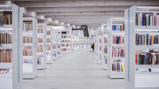 Library full of dozens of white bookshelves