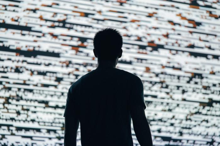 man infront of data