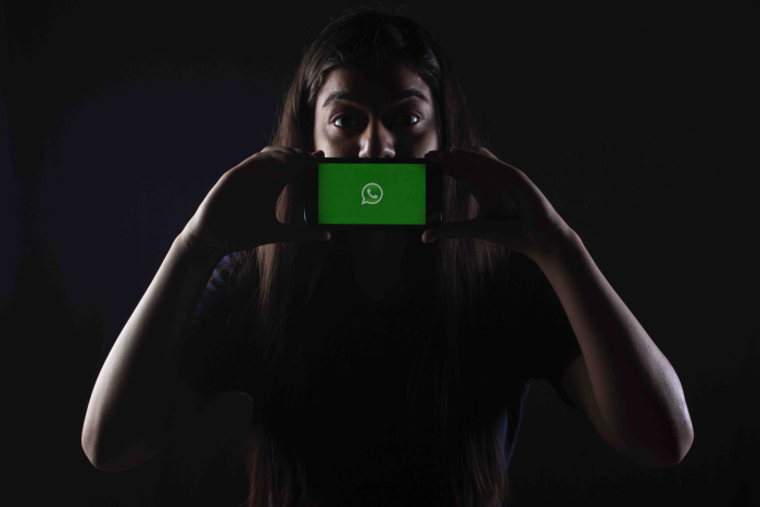 woman holding a phone