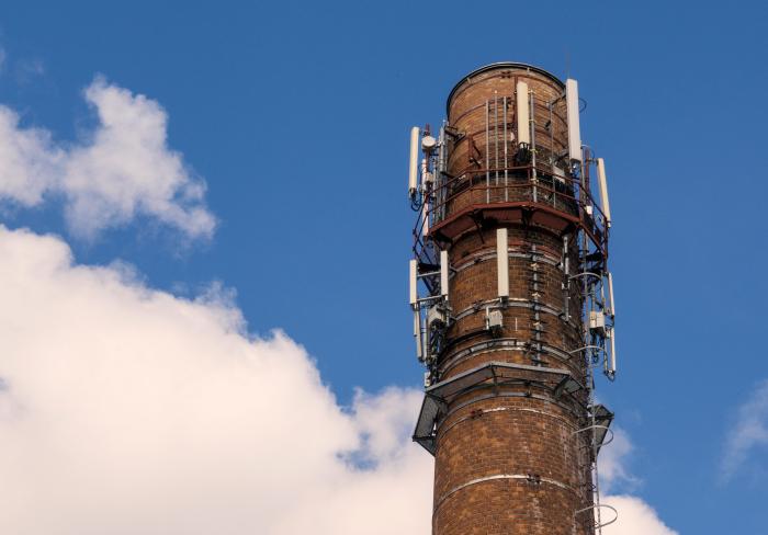 Factory chimney with mobile phone antennas