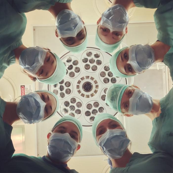 doctors looking at patient