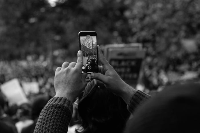 protester wiht phone