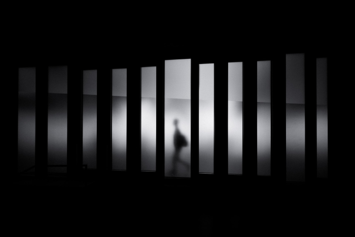 person in shadows