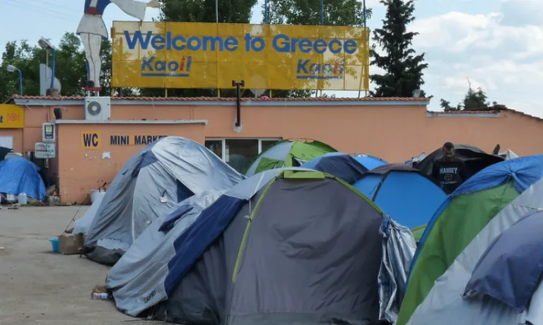 Tents and sign "Welcome to Greece"