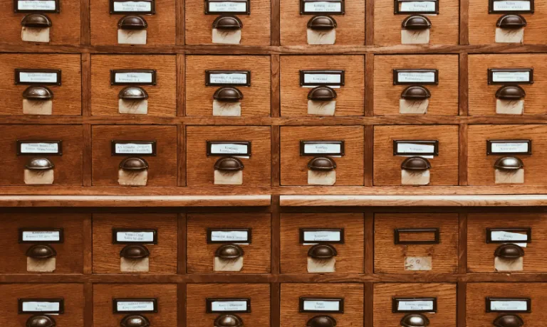 wooden drawers of paper archives