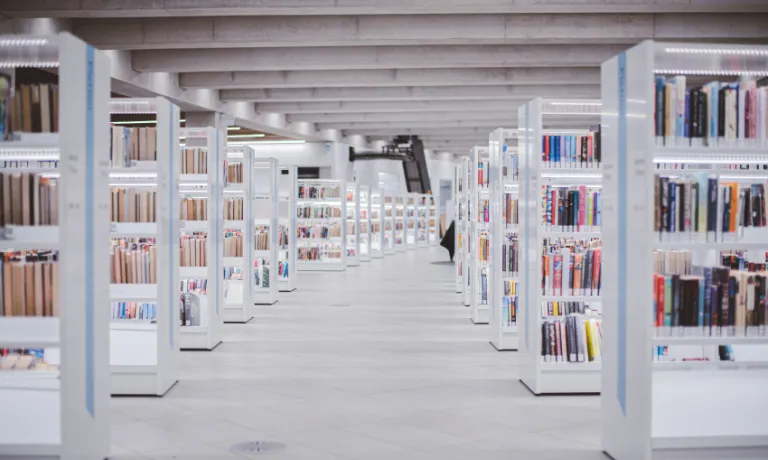 Library full of dozens of white bookshelves