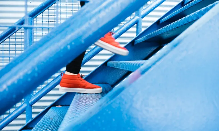 Person walking up steps