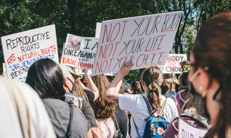 Protesters holding placards for reproductive rights