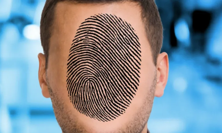 Close up of individual's face with fingerprint replacing facial features