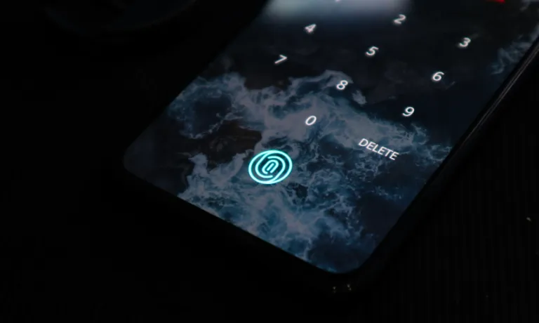 Image of smart phone with smokescreen and fingerprint icon lit up in blue.
