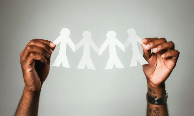 Hands holding a paper chain