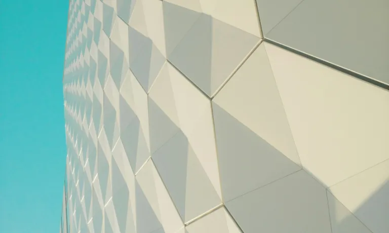 a close up of a building with a blue sky in the background