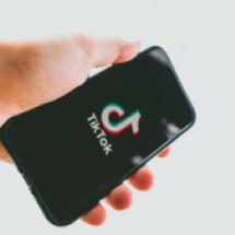 TikTok app on a phone in the hand of a person