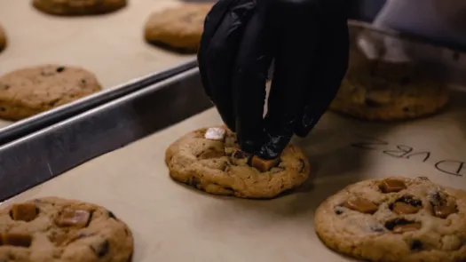 Hand reaching for a cookie