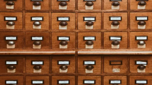 wooden drawers of paper archives