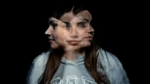 A blurred photo of a woman facing in three directions