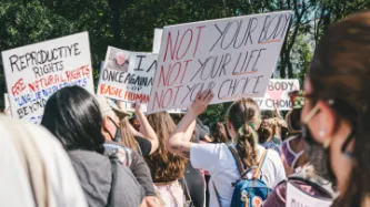 Protesters holding placards for reproductive rights 