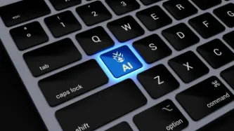 Laptop keyboard with the 'AI' appearing on the 'A' key and lit up blue with a robot logo. 