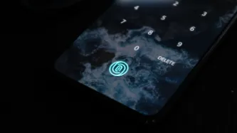 Image of smart phone with smokescreen and fingerprint icon lit up in blue.