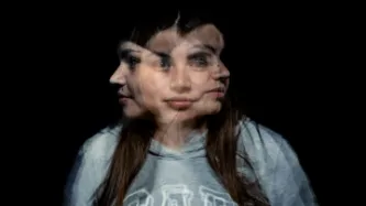 A blurred photo of a woman facing in three directions